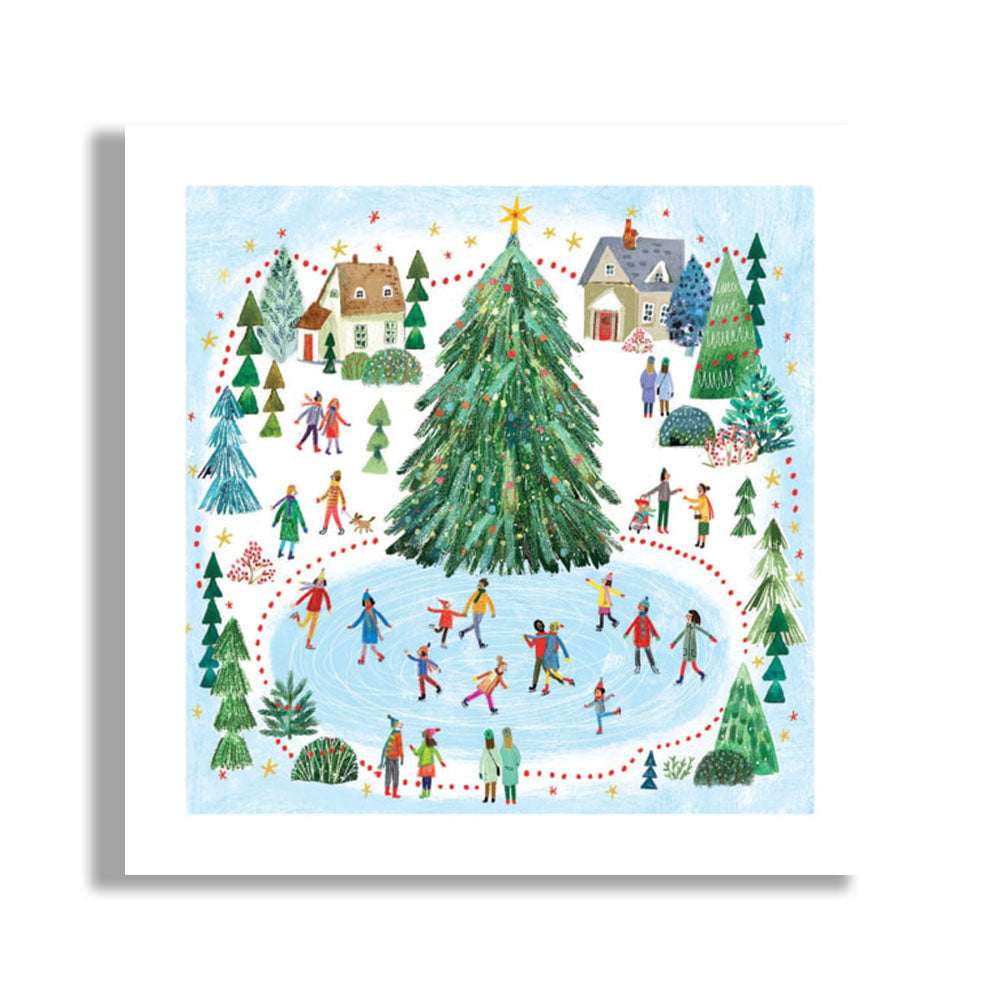 A square art print featuring a whimsical winter village scene with a large decorated Christmas tree in the center, people ice skating around it, small houses, and evergreen trees, shown against a white background with a soft drop shadow.