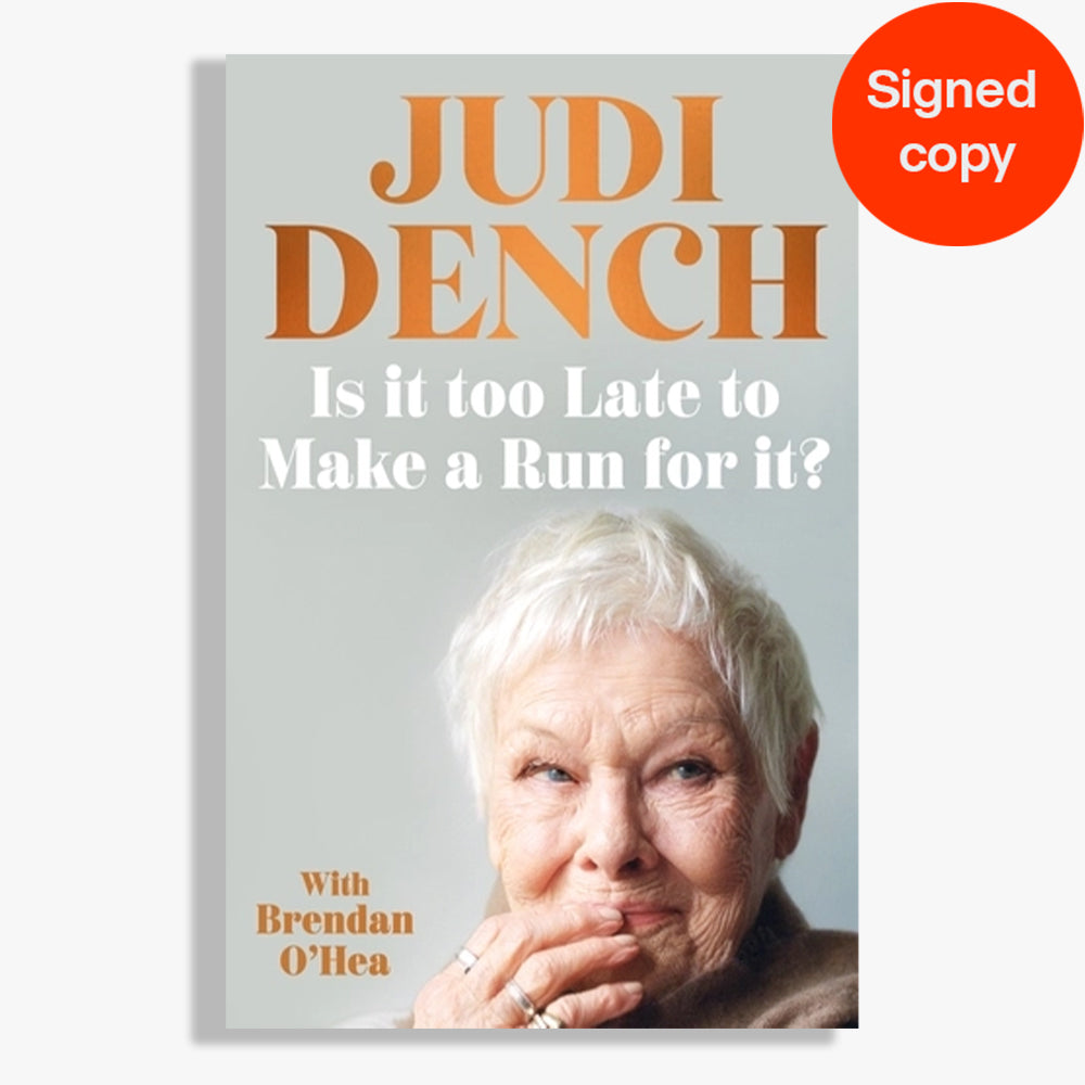 A book cover for 'Judi Dench: Is it too Late to Make a Run for it?' featuring a portrait of Judi Dench on a light gray background with orange and white text. A red circular badge in the top right corner reads 'Signed copy'.